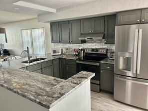 Condo, 2 Bedrooms, 2 Bathrooms | Private kitchen | Full-sized fridge, microwave, stovetop, dishwasher