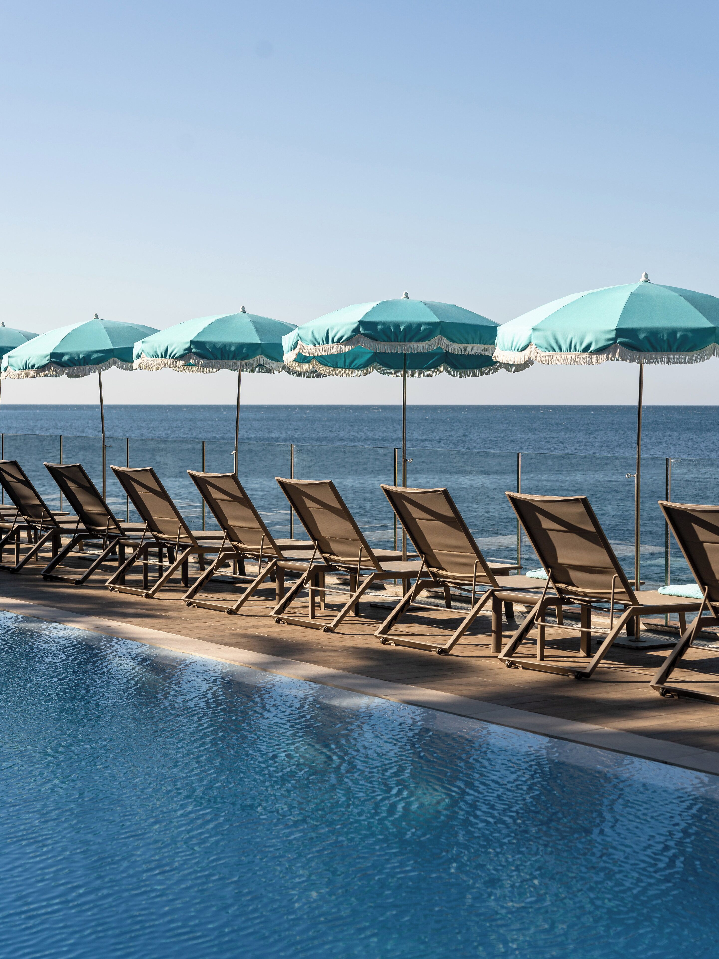 2 outdoor pools, pool umbrellas, pool loungers