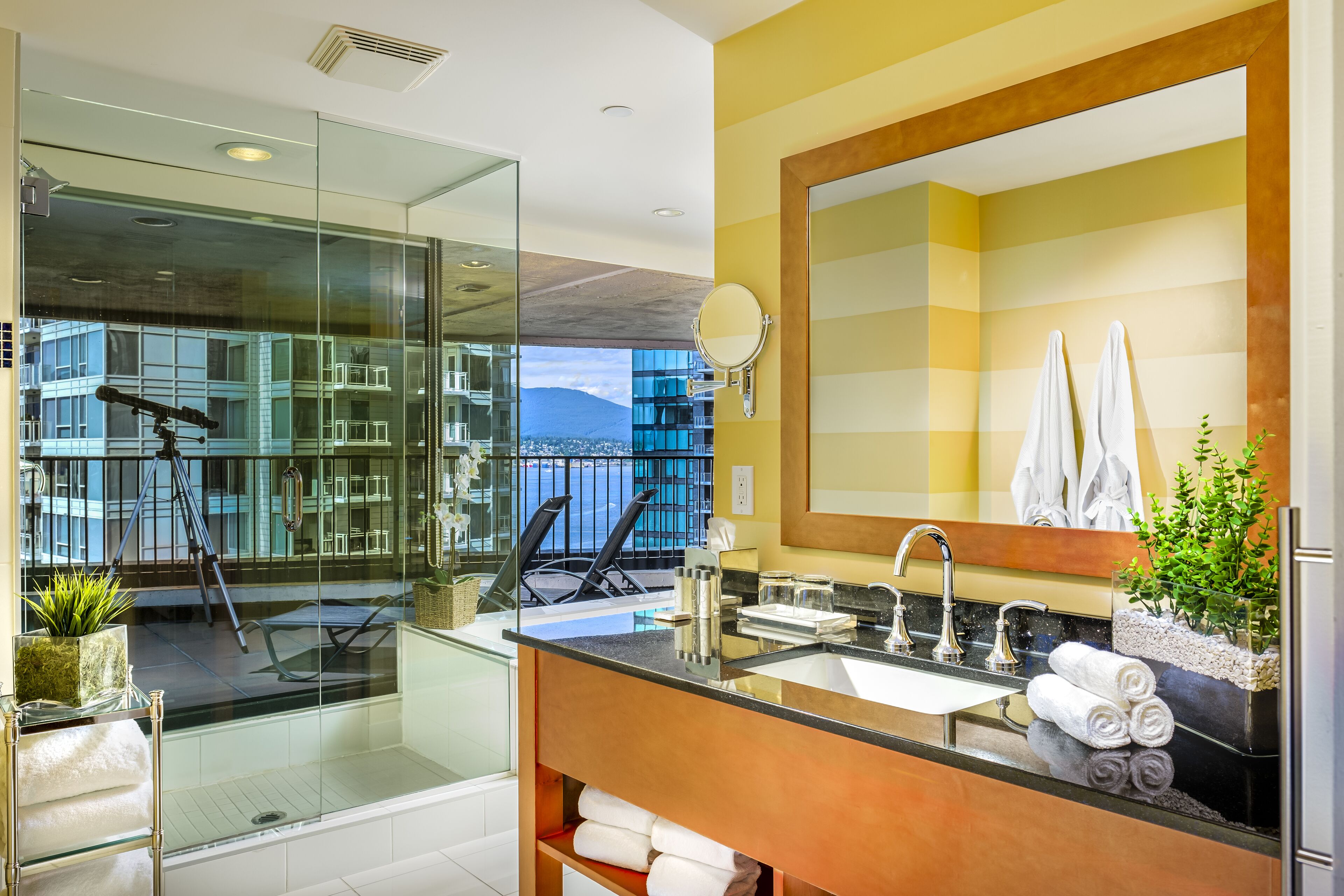 suite (coal harbour) | bathroom | combined shower/bathtub, designer toiletries, hair dryer, towels