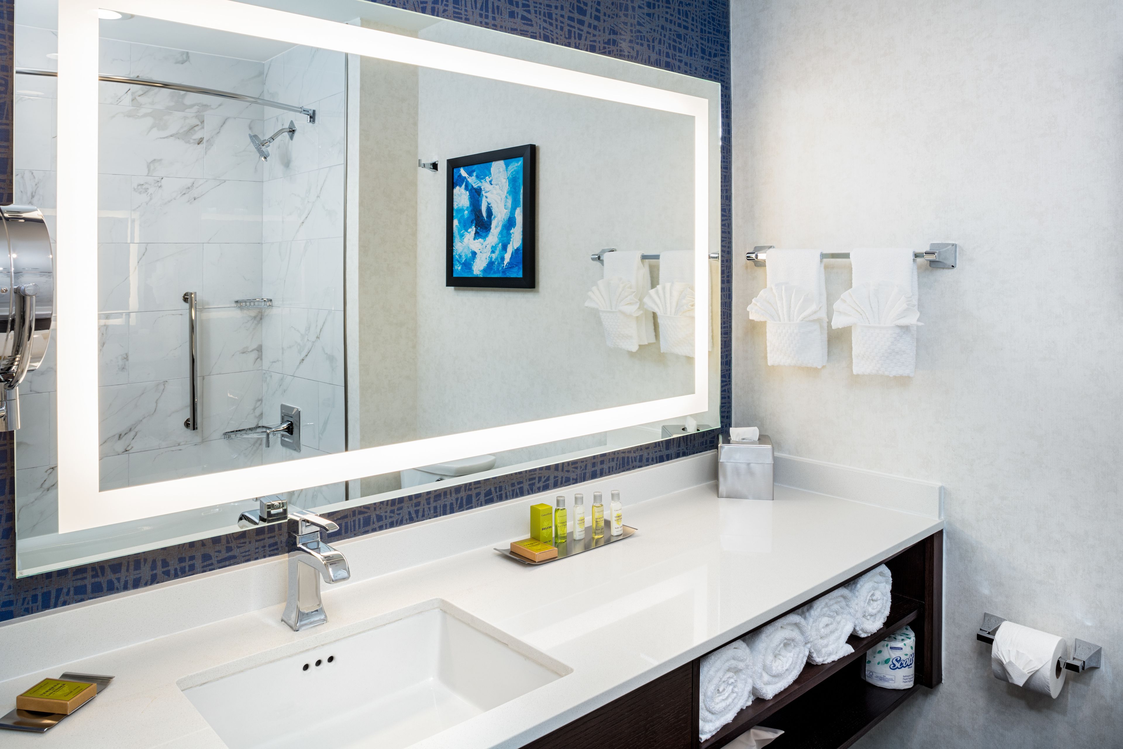 designer toiletries, hair dryer, bathrobes, towels