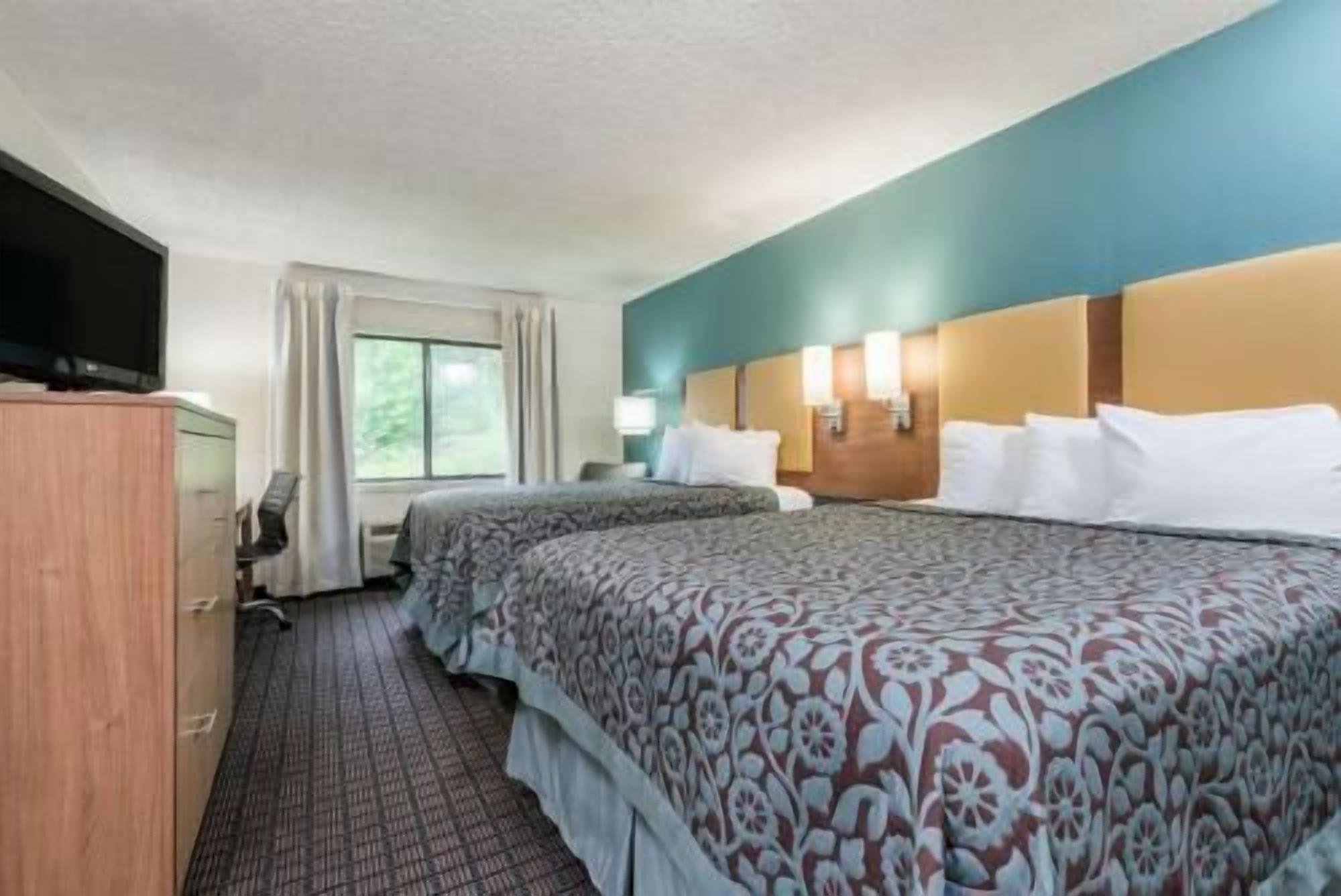 Pillowtop beds, desk, blackout drapes, iron/ironing board