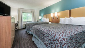 A hotel room with two beds, a TV, a desk, and a window with curtains. - Days Inn by Wyndham Ashland (Ashland)
