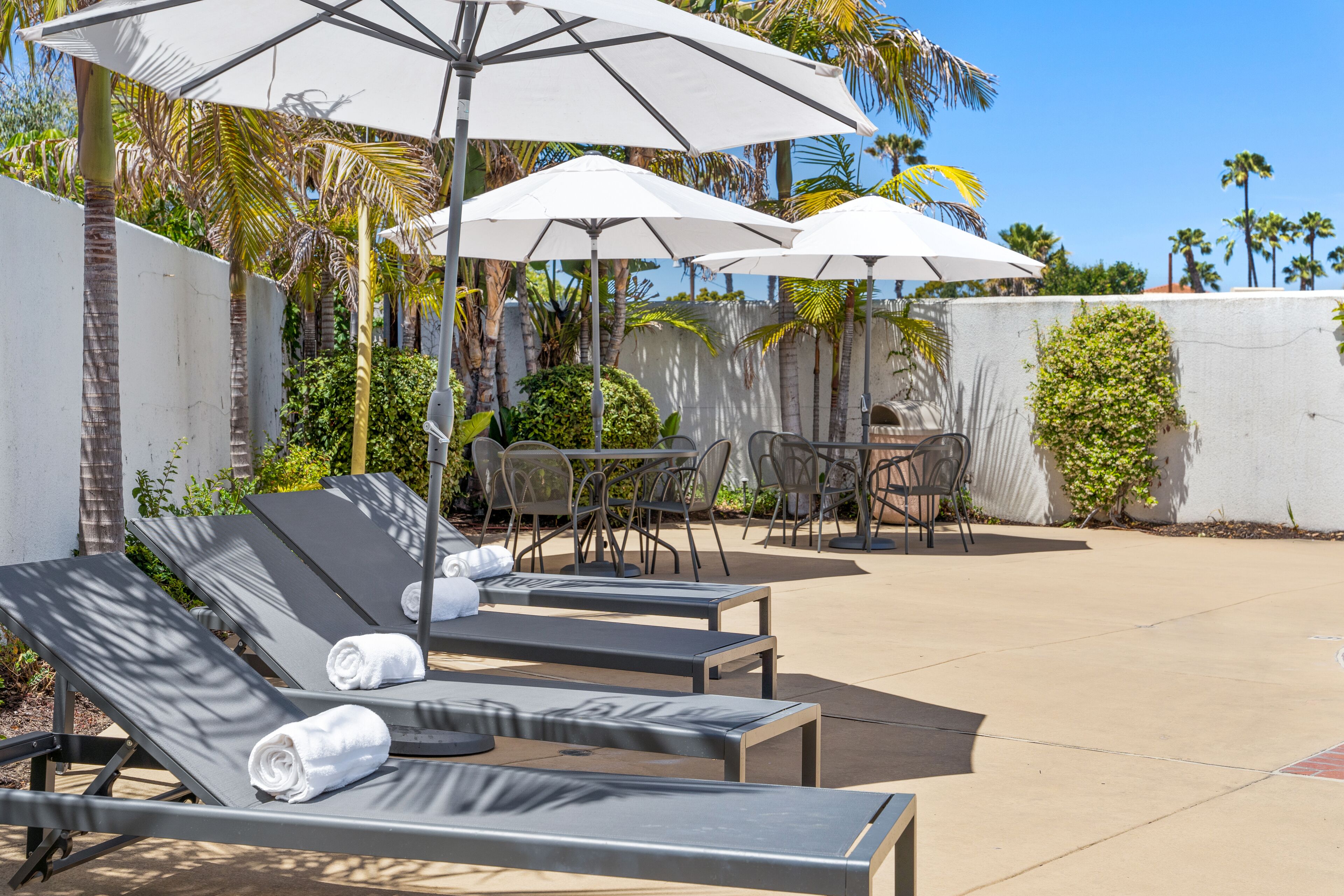 outdoor pool, pool umbrellas, pool loungers