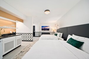 Deluxe Room, 2 Queen Beds | Hypo-allergenic bedding, in-room safe, desk, laptop workspace