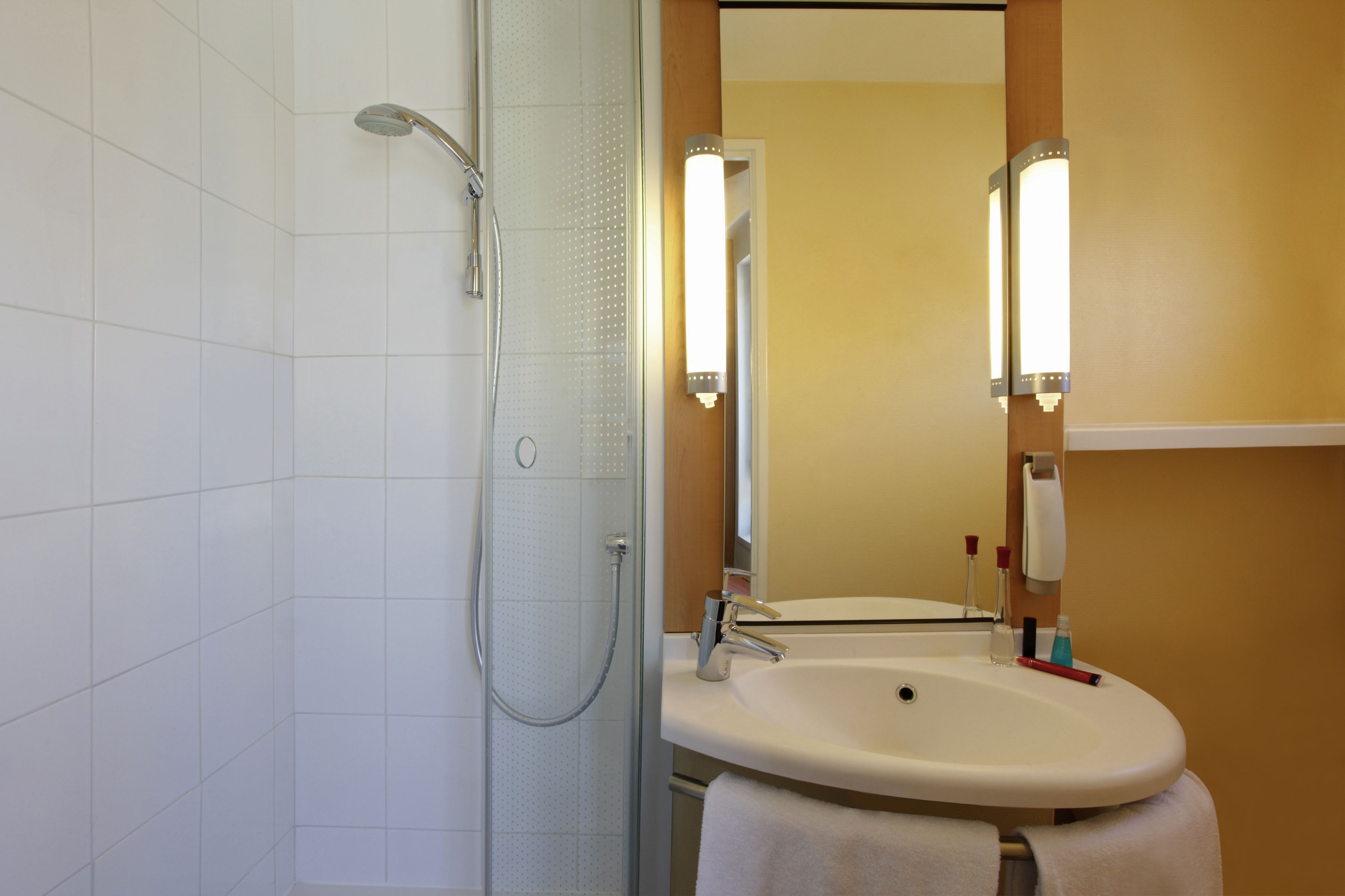 eco-friendly toiletries, hair dryer, towels