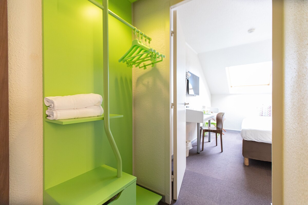 Premium bedding, desk, laptop workspace, blackout curtains
