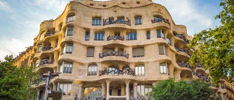 A building with multiple balconies and a unique architectural style.