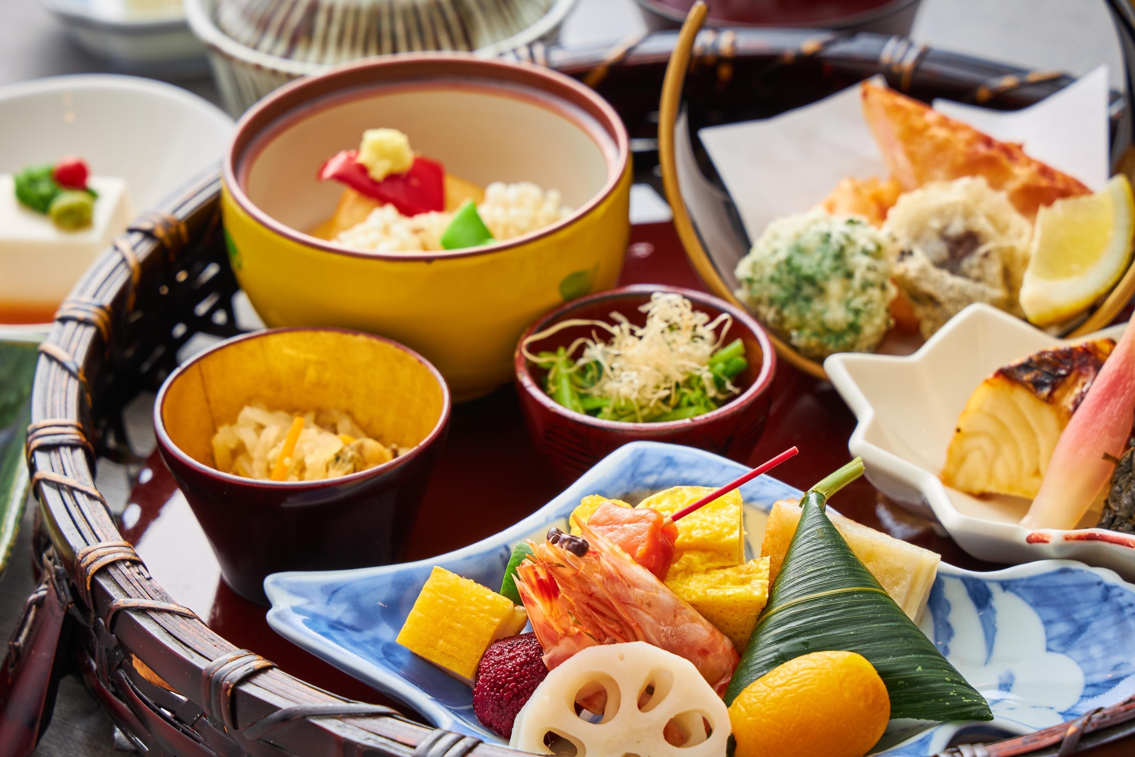 A variety of dishes on a tray, including seafood, vegetables, and rice.