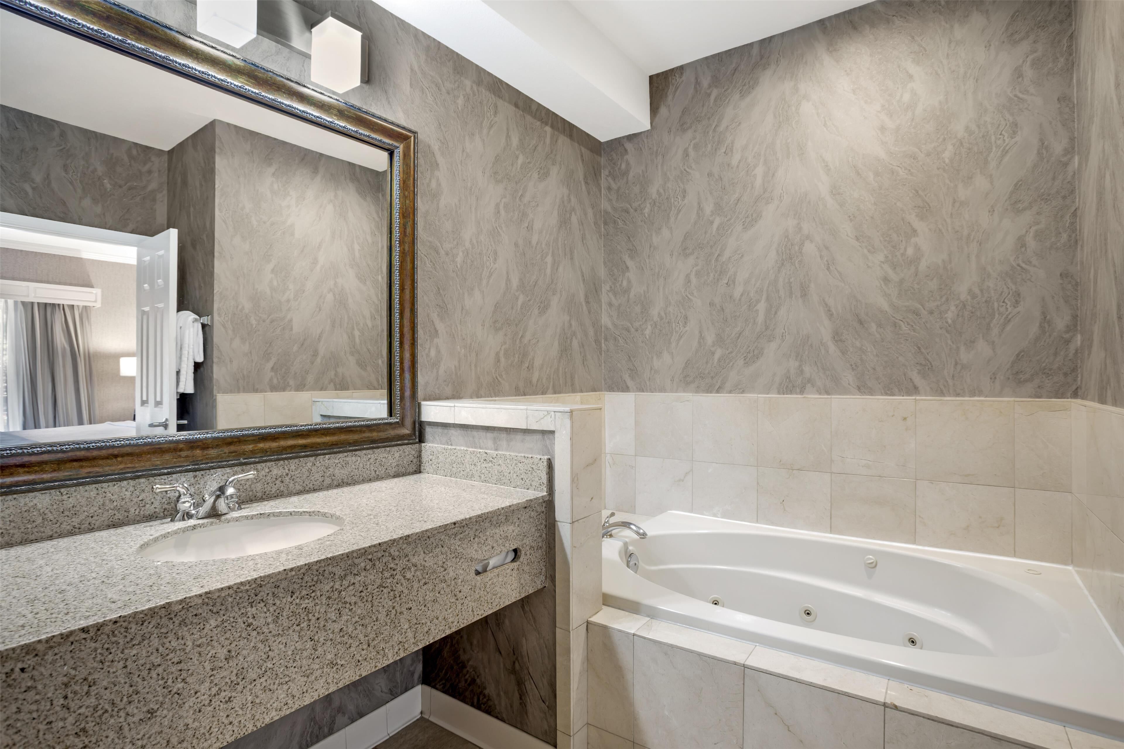 suite, 1 king bed, non smoking, balcony (with sofabed) | bathroom | combined shower/bathtub, designer toiletries, hair dryer, towels