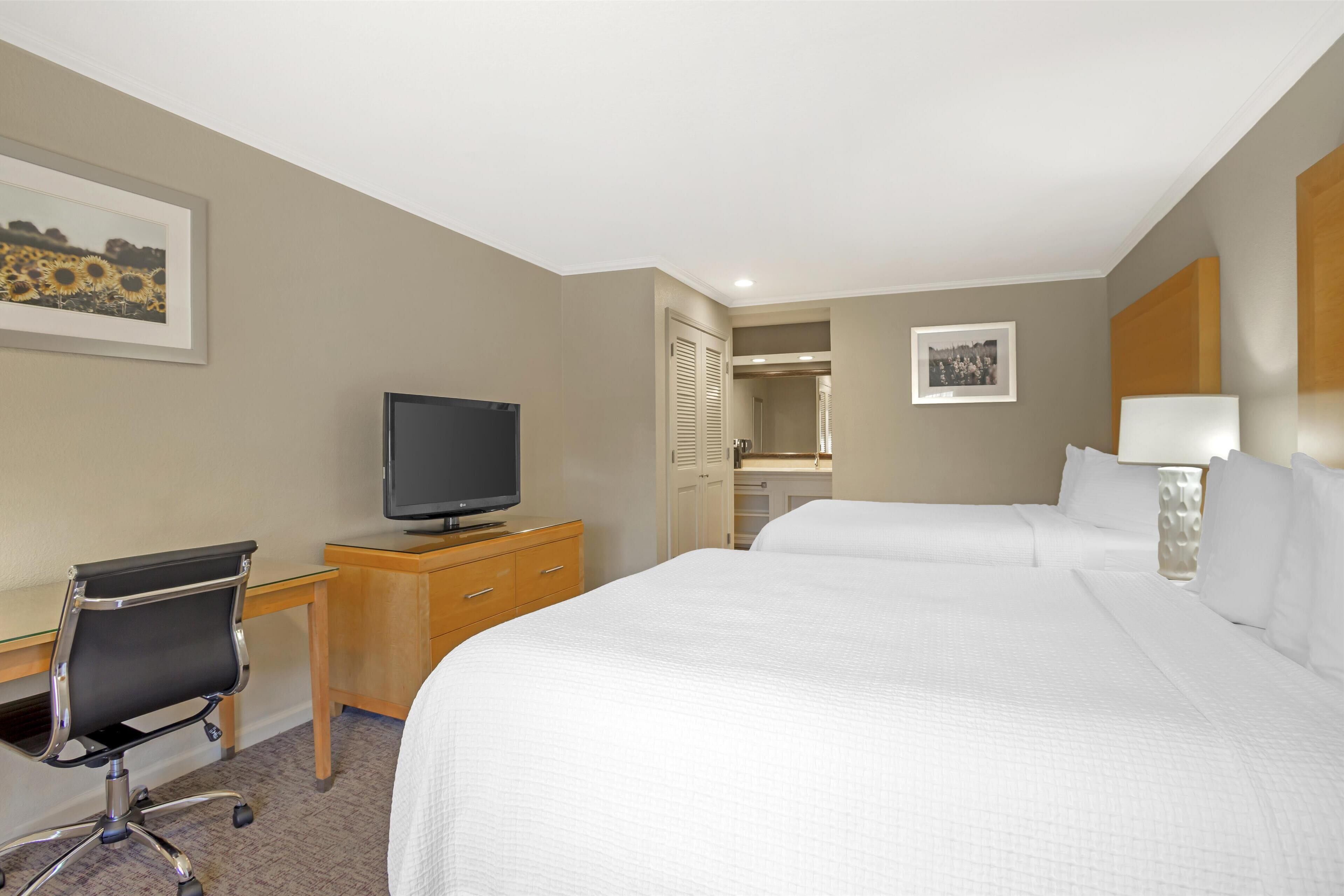 standard room, 2 queen beds, non smoking, refrigerator & microwave (exterior corridor) | 1 bedroom, hypo-allergenic bedding, in-room safe, desk