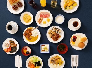 A variety of dishes and beverages arranged on a table, suggesting a meal setting. - Bellevue Garden Hotel Kansai International Airport (Izumisano)