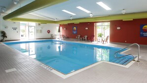 An indoor swimming pool with clear markings, a lifeguard chair, and a Comfort Inn sign. - Comfort Inn (Cornwall)