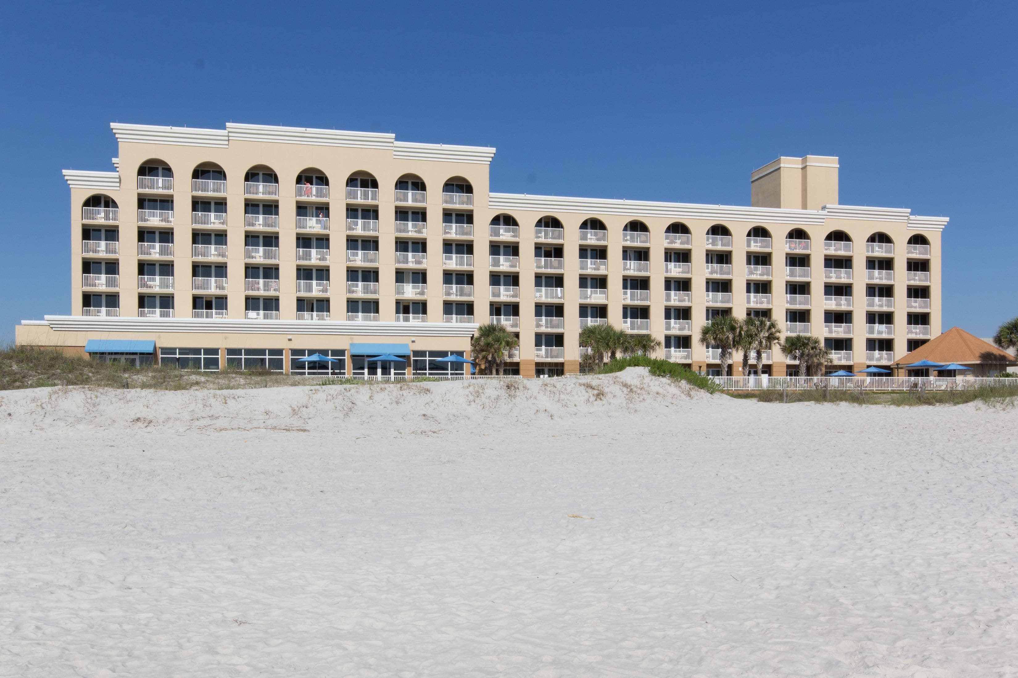 on the beach, white sand, sun-loungers, beach umbrellas