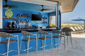 Outdoor pool, open 7:00 AM to 10:00 PM, pool umbrellas, pool loungers