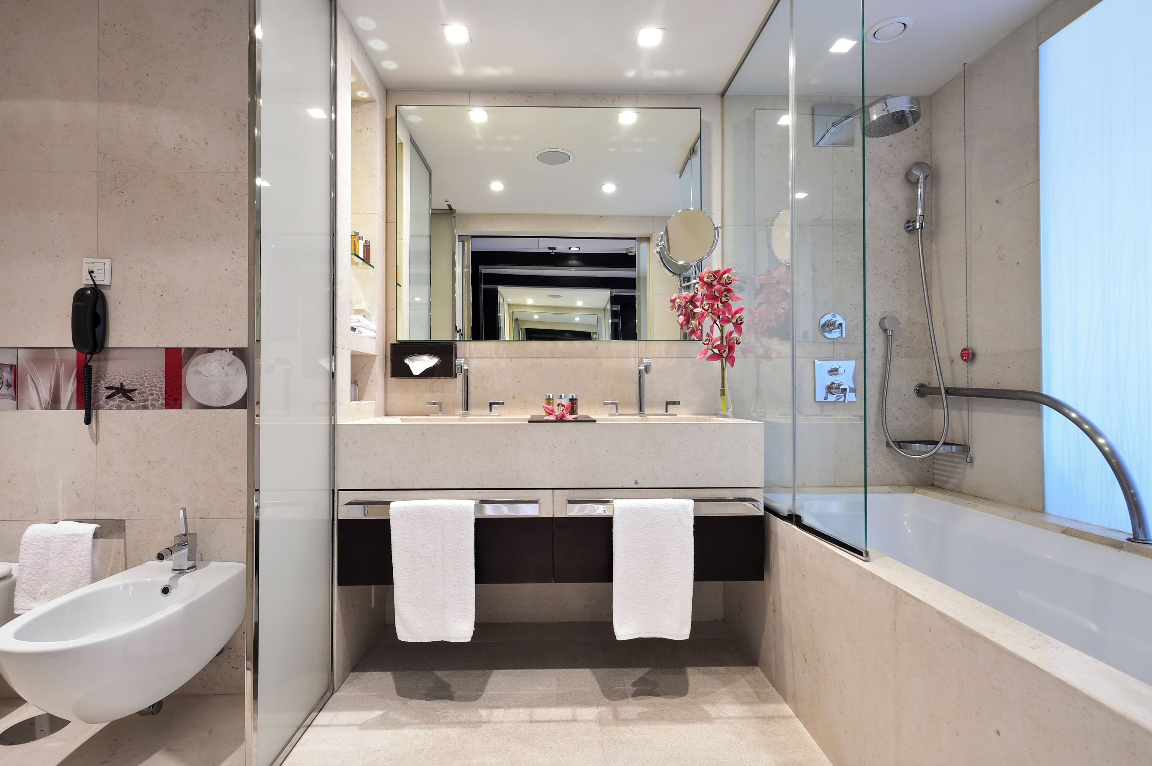 combined shower/bathtub, rainfall showerhead, designer toiletries