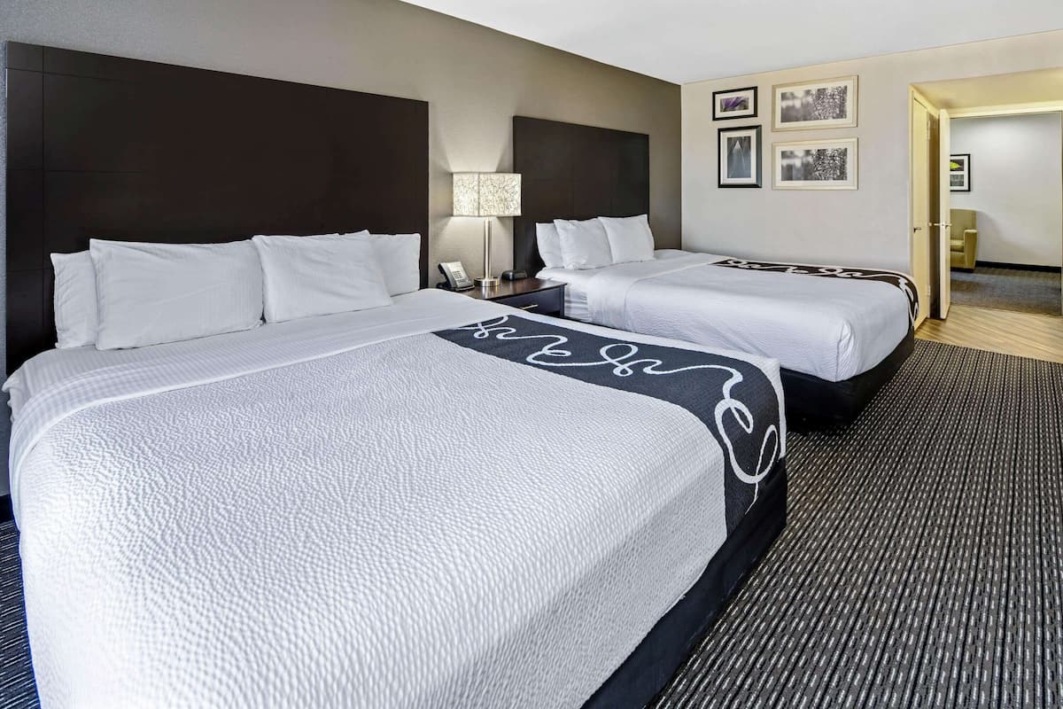 Suite, Multiple Beds | Premium bedding, desk, blackout drapes, iron/ironing board