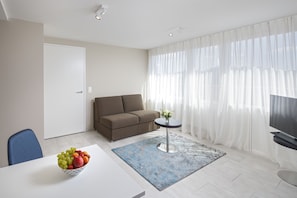 Sky Suite | Area soggiorno | TV a schermo piatto