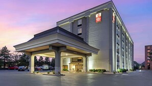 A hotel with a covered entrance, a sign indicating it is a Best Western Plus, and a parking lot with several cars. - Best Western Plus Chicagoland - Countryside (Countryside)