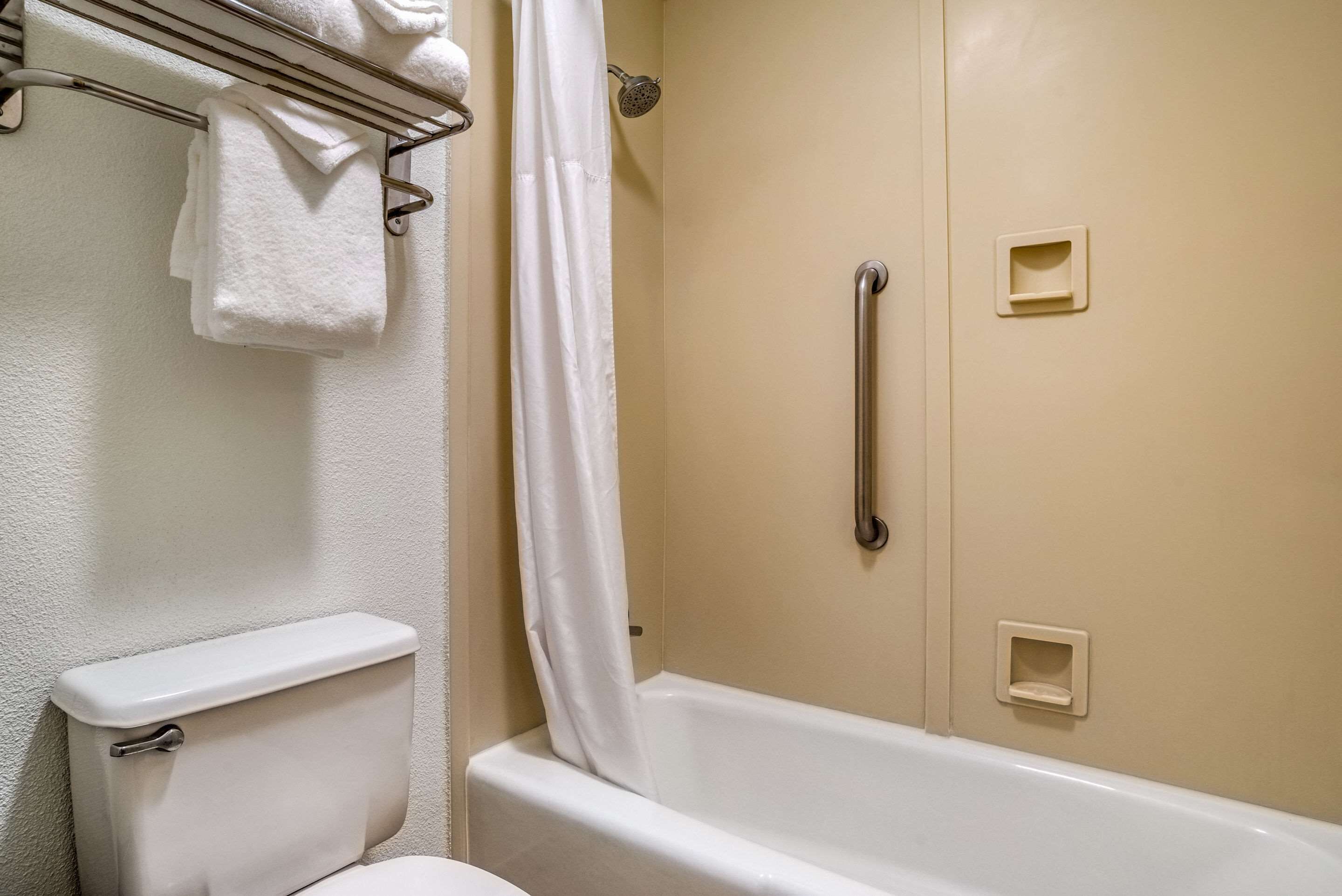 bathtub, free toiletries, hair dryer, towels