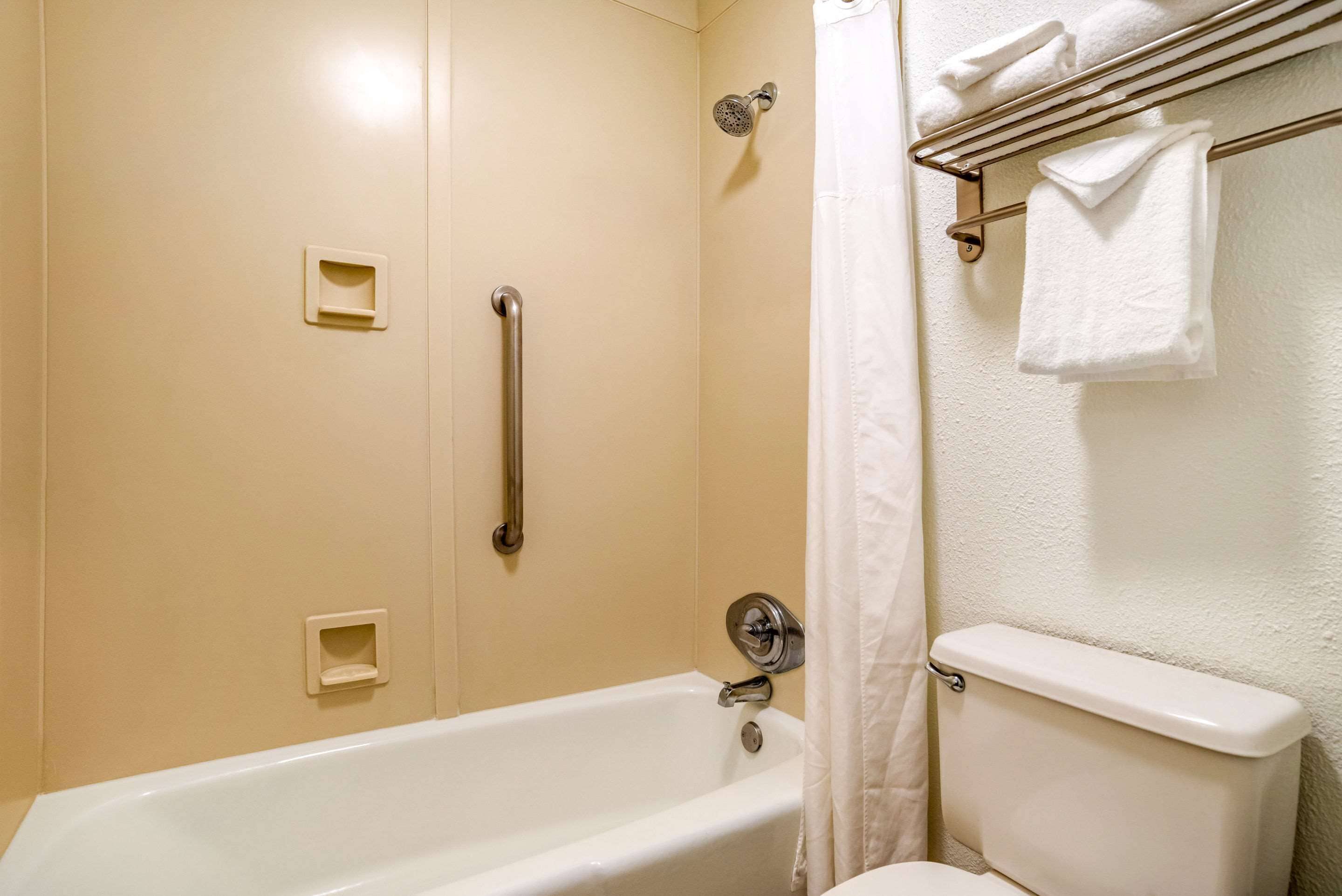 bathtub, free toiletries, hair dryer, towels