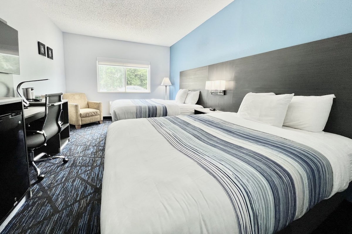 Premium bedding, pillow-top beds, desk, laptop workspace