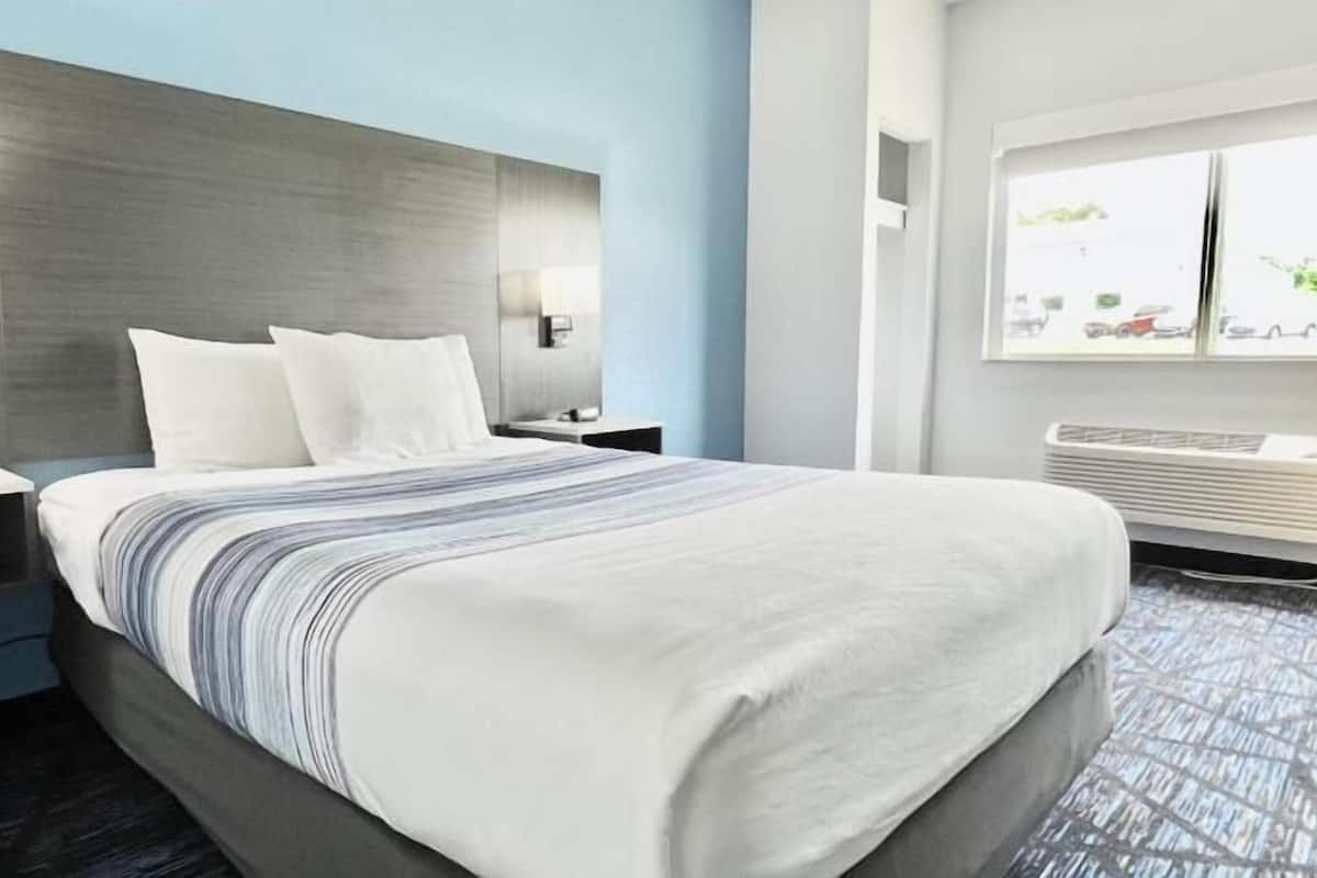 Premium bedding, pillow-top beds, desk, laptop workspace