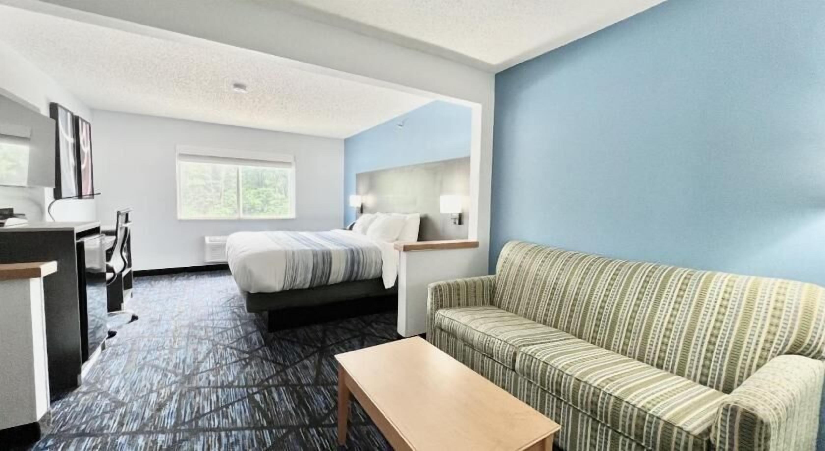 Premium bedding, pillow-top beds, desk, laptop workspace