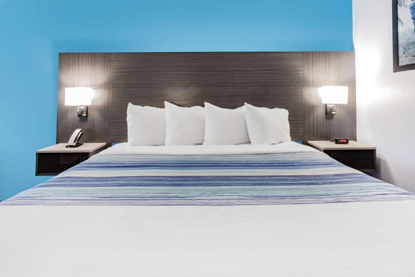 Premium bedding, pillow-top beds, desk, laptop workspace