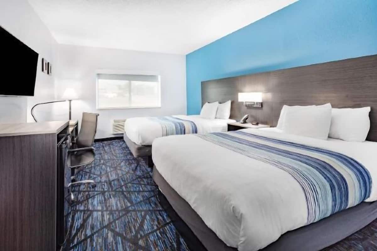 Premium bedding, pillowtop beds, desk, laptop workspace