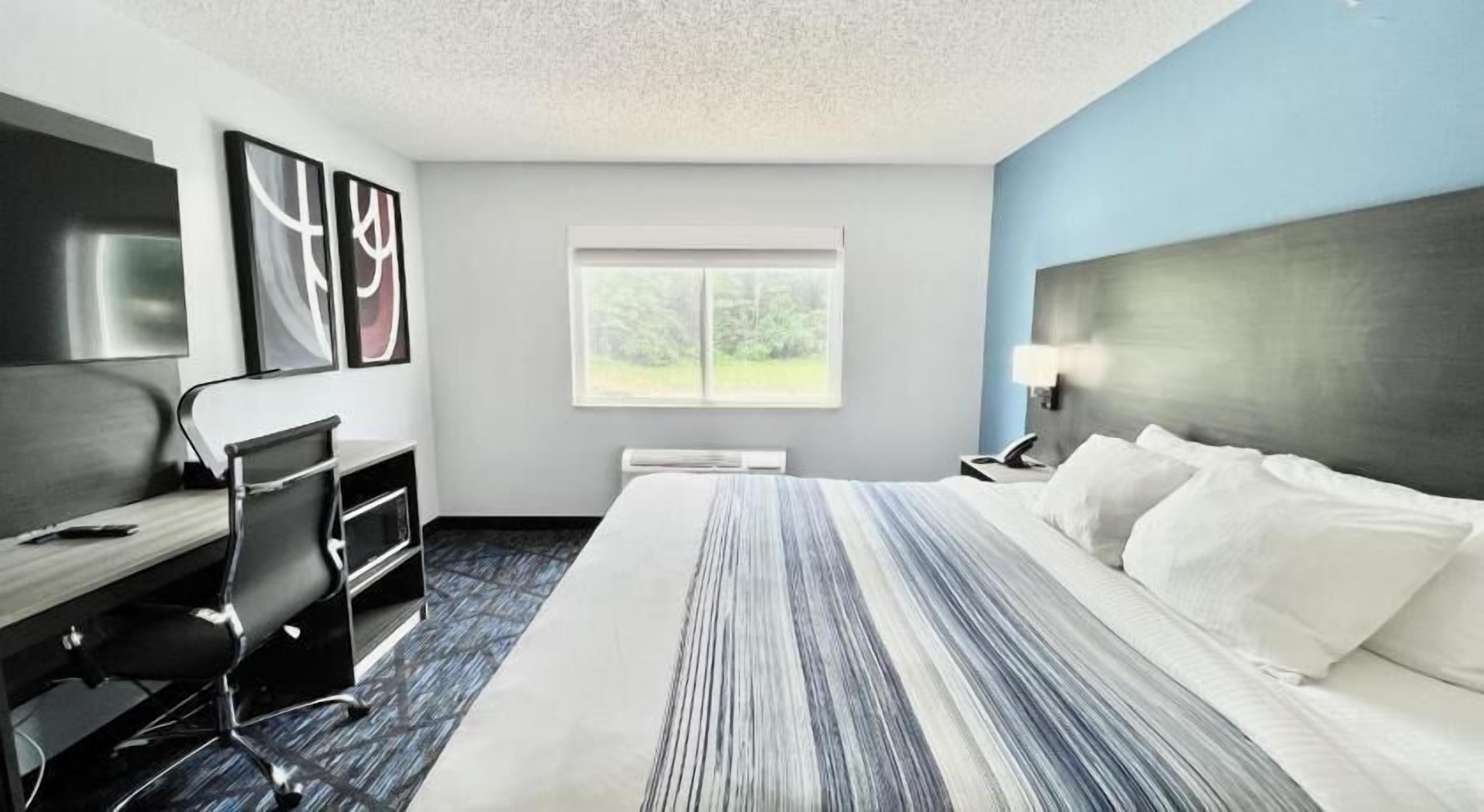 Premium bedding, pillow-top beds, desk, laptop workspace