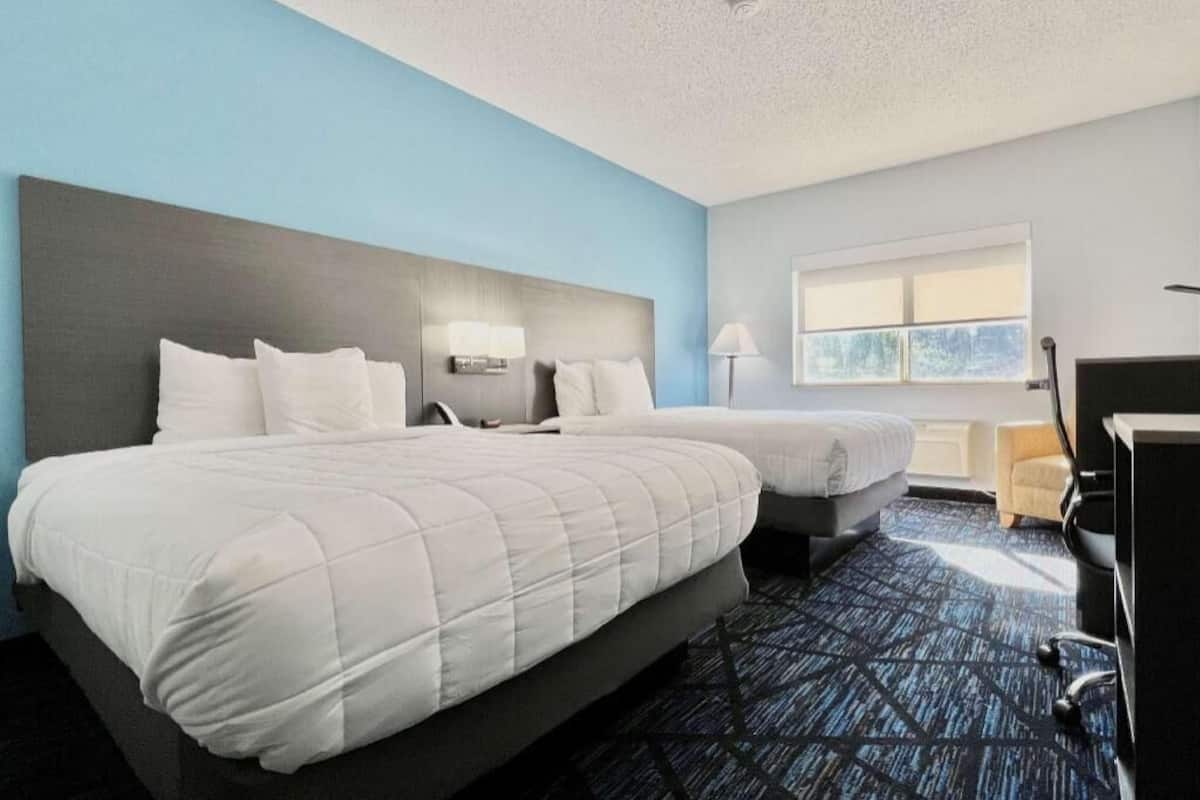 Premium bedding, pillow-top beds, desk, laptop workspace