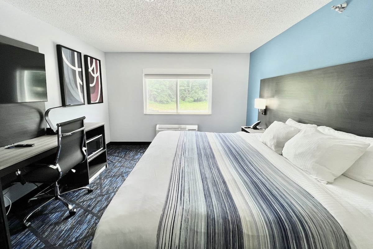 Premium bedding, pillow-top beds, desk, laptop workspace