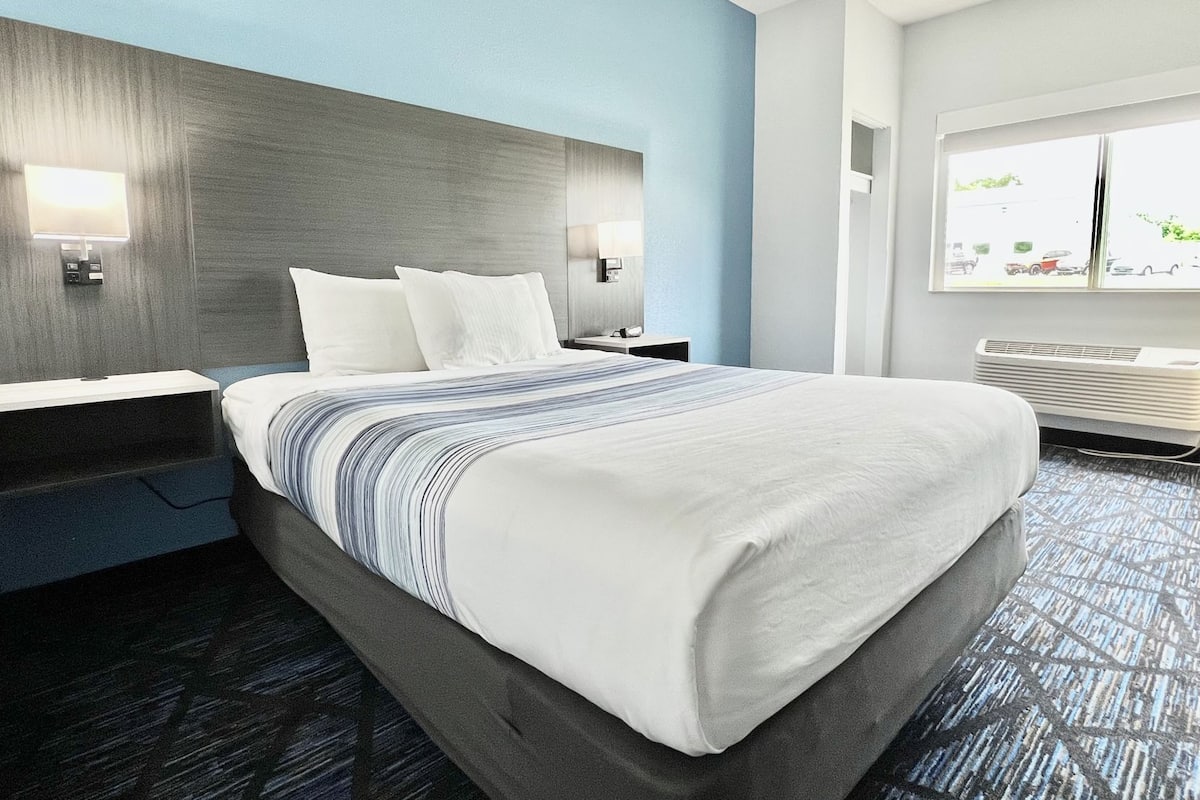 Premium bedding, pillow-top beds, desk, laptop workspace