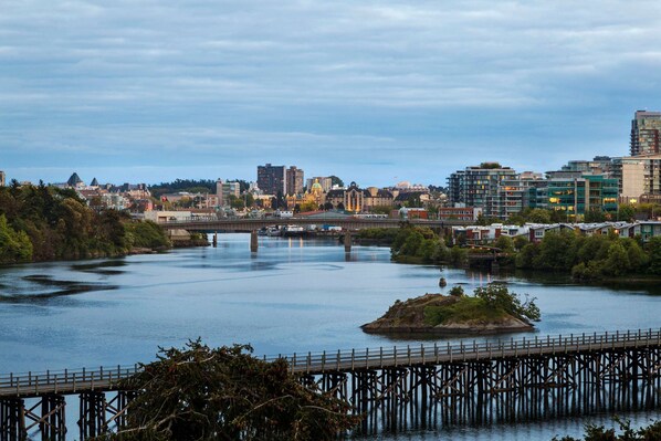 Stunning cityscape with a majestic bridge spanning the river, offering breathtaking views of the surrounding architecture.