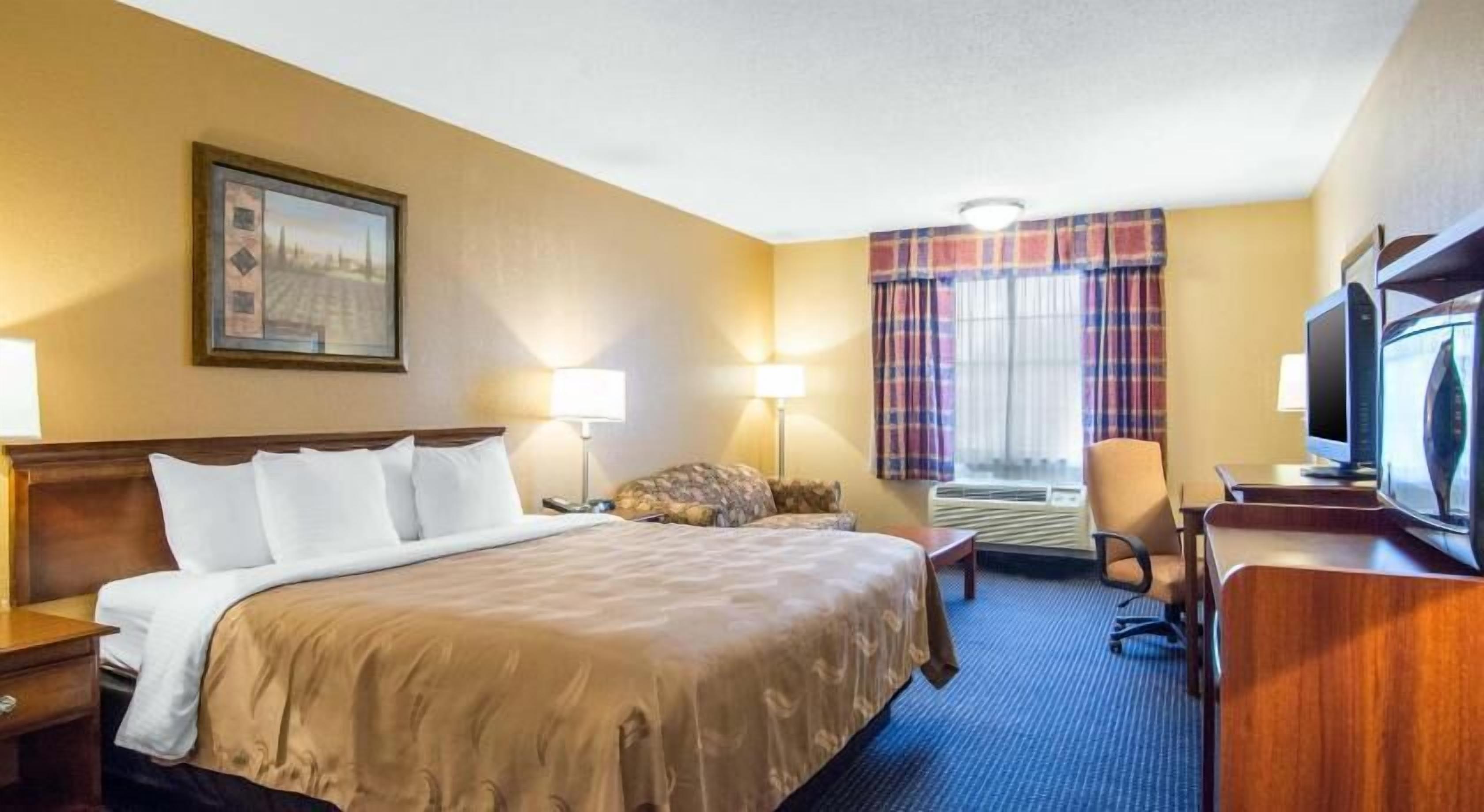 Desk, laptop workspace, iron/ironing board, free cribs/infant beds