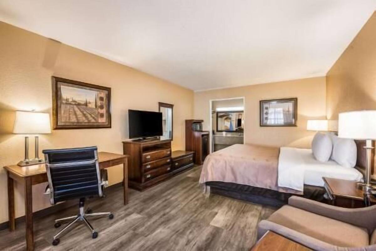 Desk, laptop workspace, iron/ironing board, free cribs/infant beds