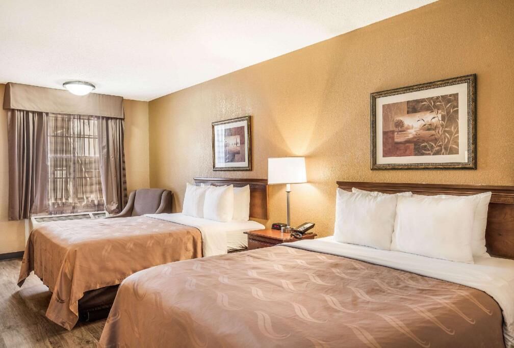 Desk, laptop workspace, iron/ironing board, free cribs/infant beds