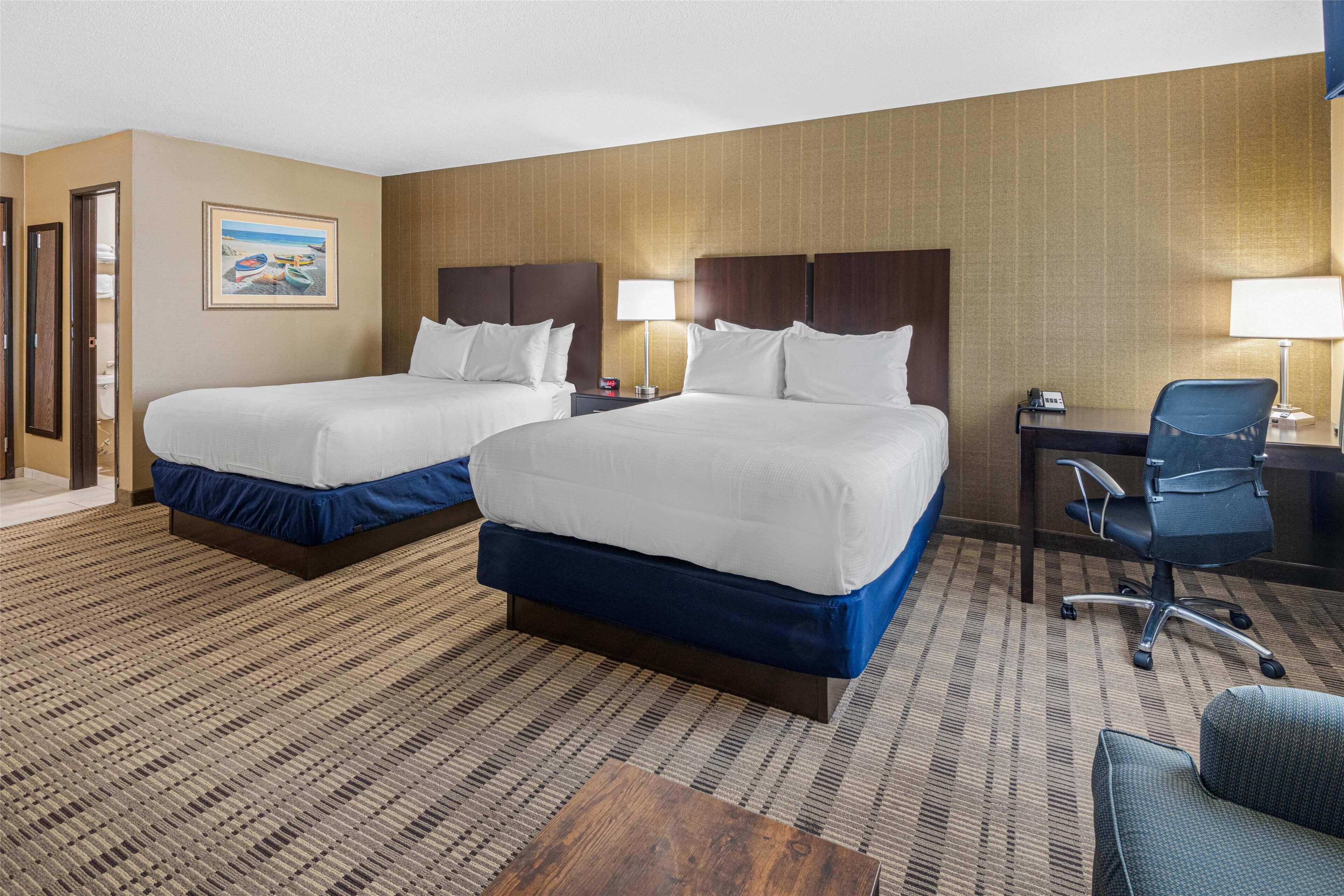 suite, 2 queen beds, non smoking, refrigerator & microwave (with sofabed) | in-room safe, desk, blackout curtains, iron/ironing board