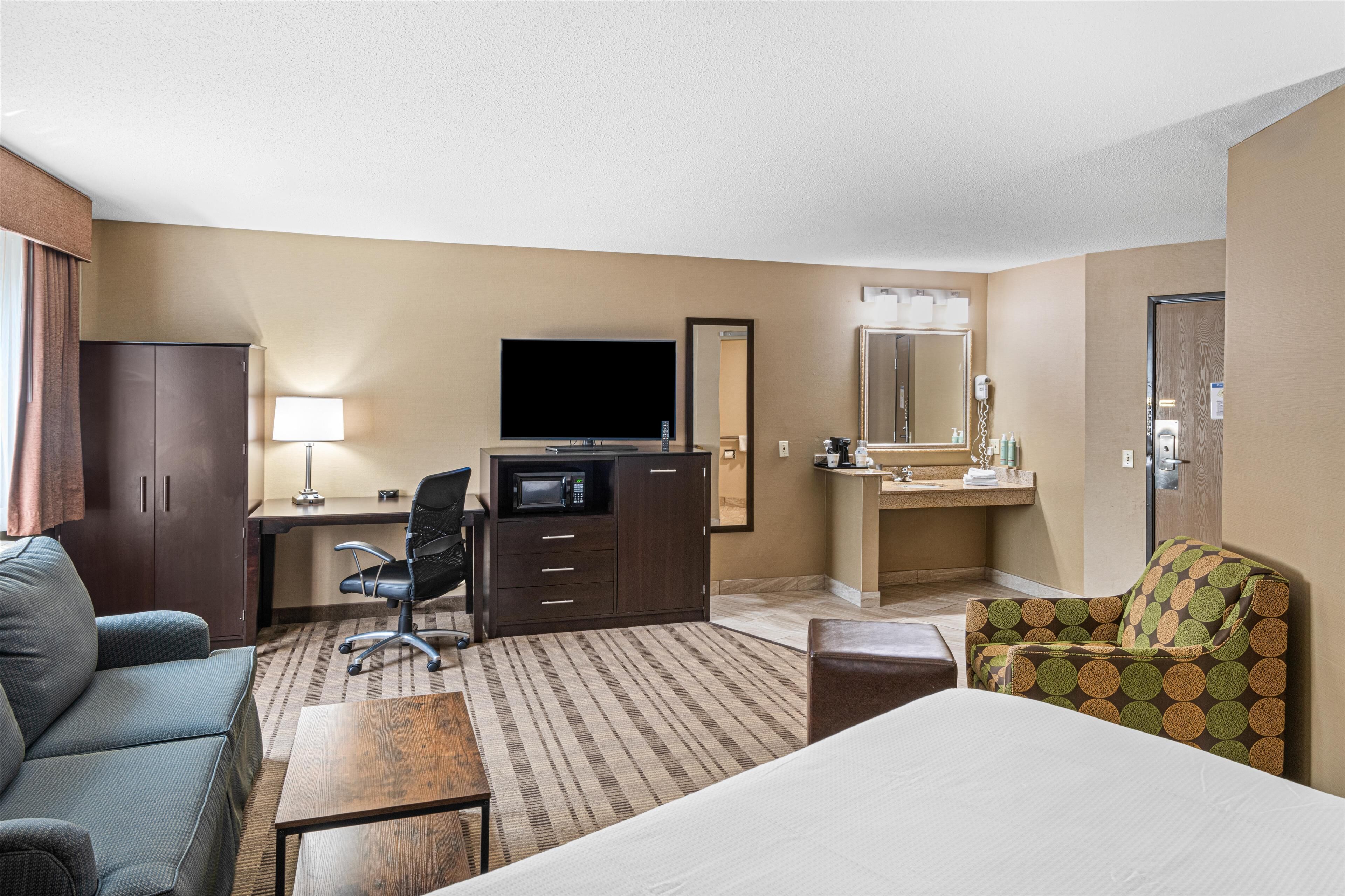 Suite, 1 King Bed, Accessible, Refrigerator &amp; Microwave (with Sofabed) | In-room safe, desk, blackout curtains, iron/ironing board