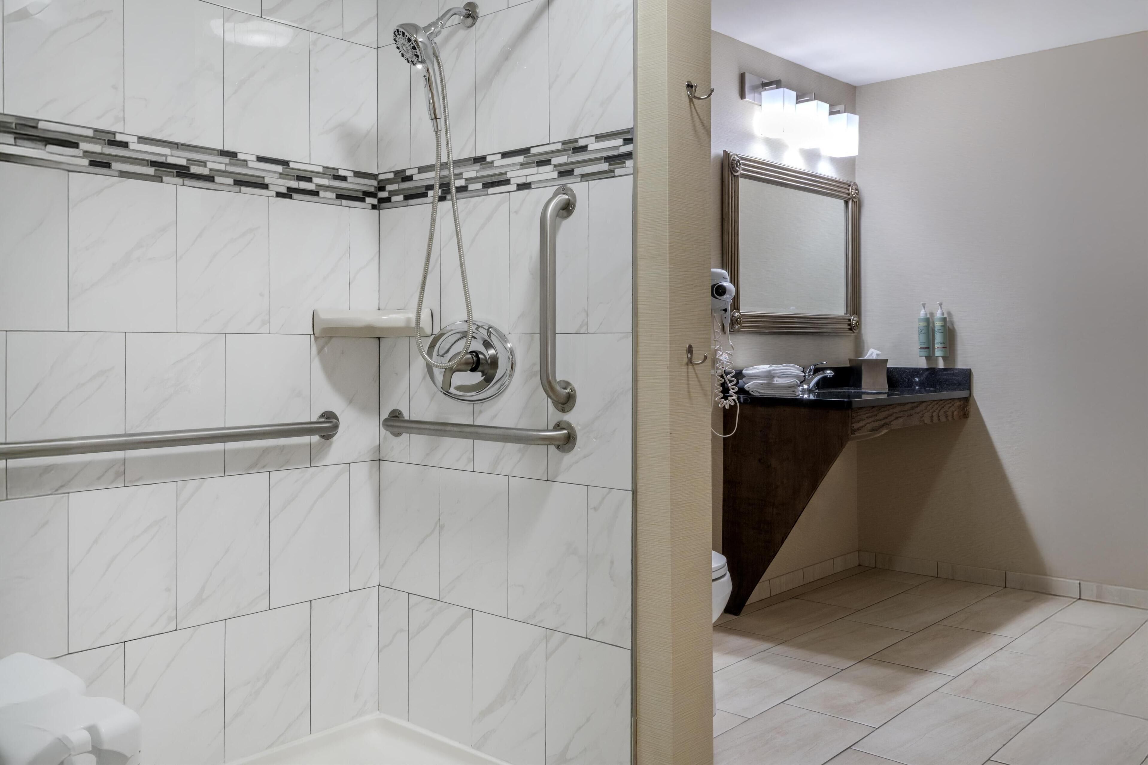 suite, 2 queen beds, accessible, non smoking (living room;with sofabed) | bathroom | combined shower/bathtub, free toiletries, hair dryer, towels