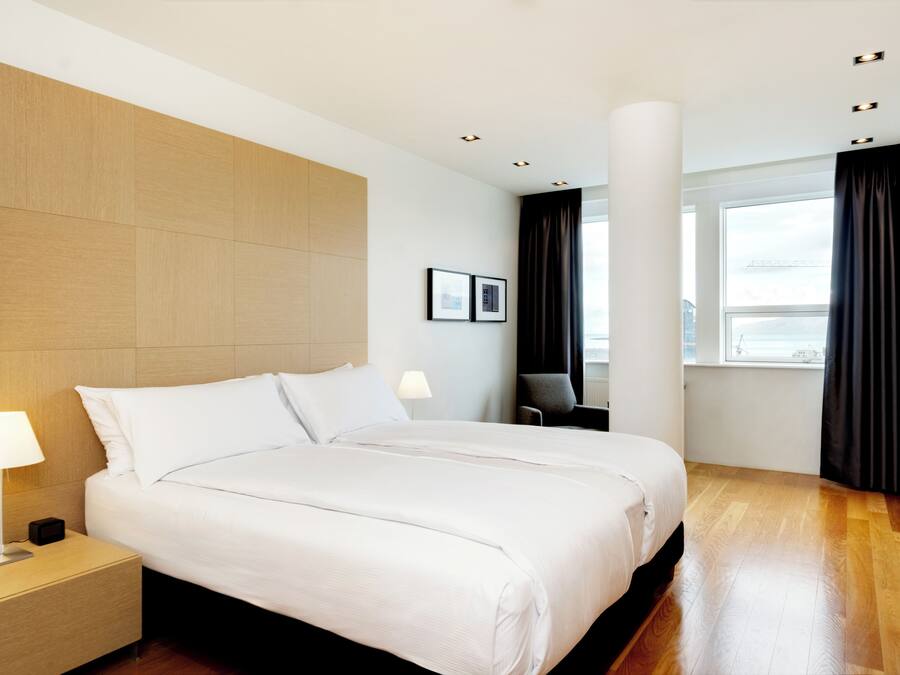 King Suite | Hypo-allergenic bedding available, down comforters, in-room safe, desk