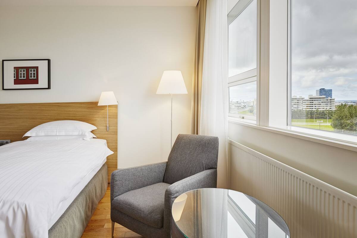 Hypo-allergenic bedding available, down comforters, in-room safe, desk