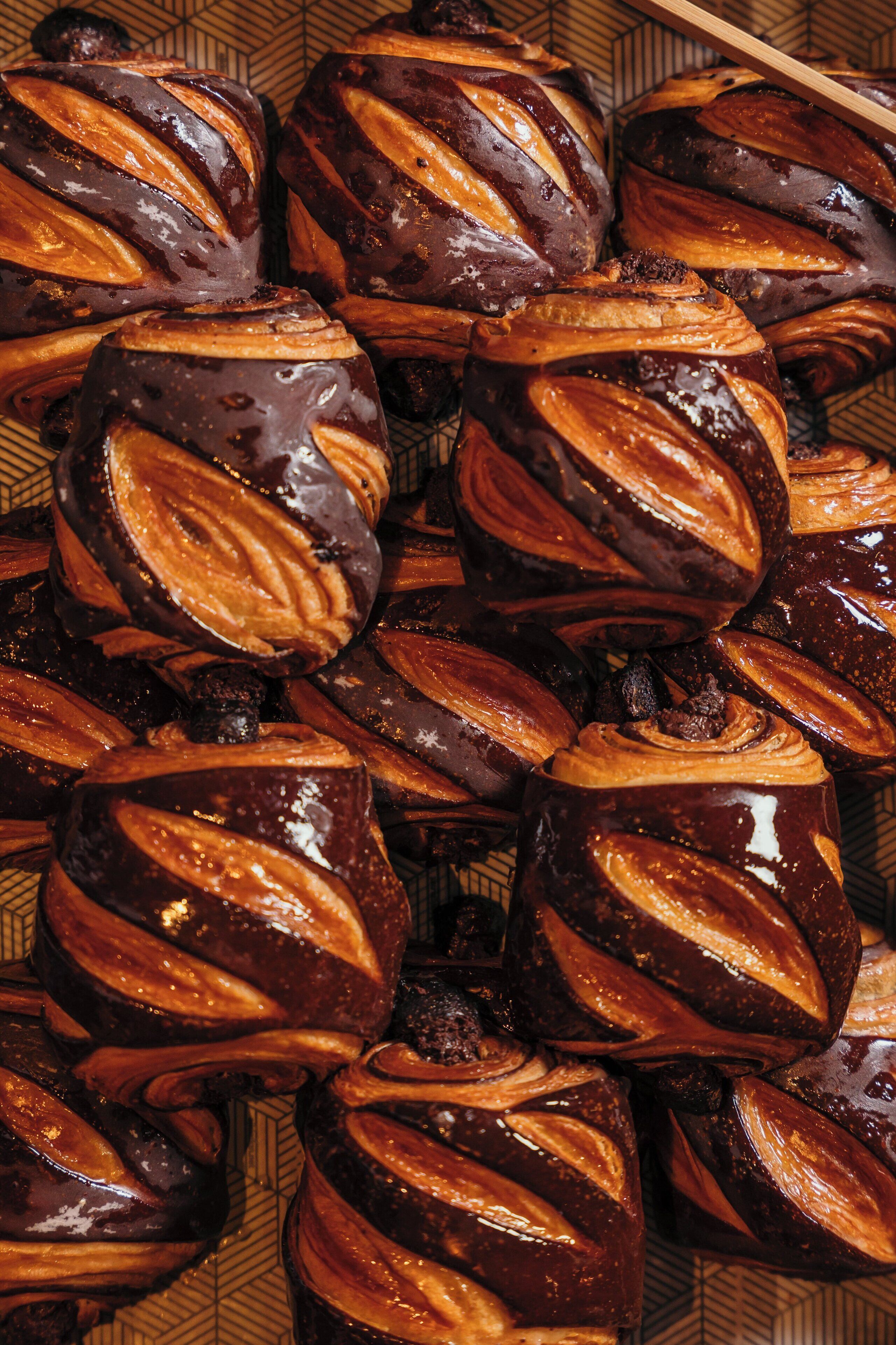 A close-up of glazed pastries with a swirled pattern.