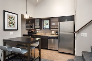 Suite, 1 Double Bed | Private kitchen | Full-size fridge, microwave, coffee/tea maker, cookware/dishes/utensils