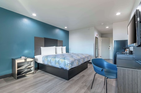 In-room safe, desk, laptop workspace, iron/ironing board. Studio 6 Suites Perris, CA