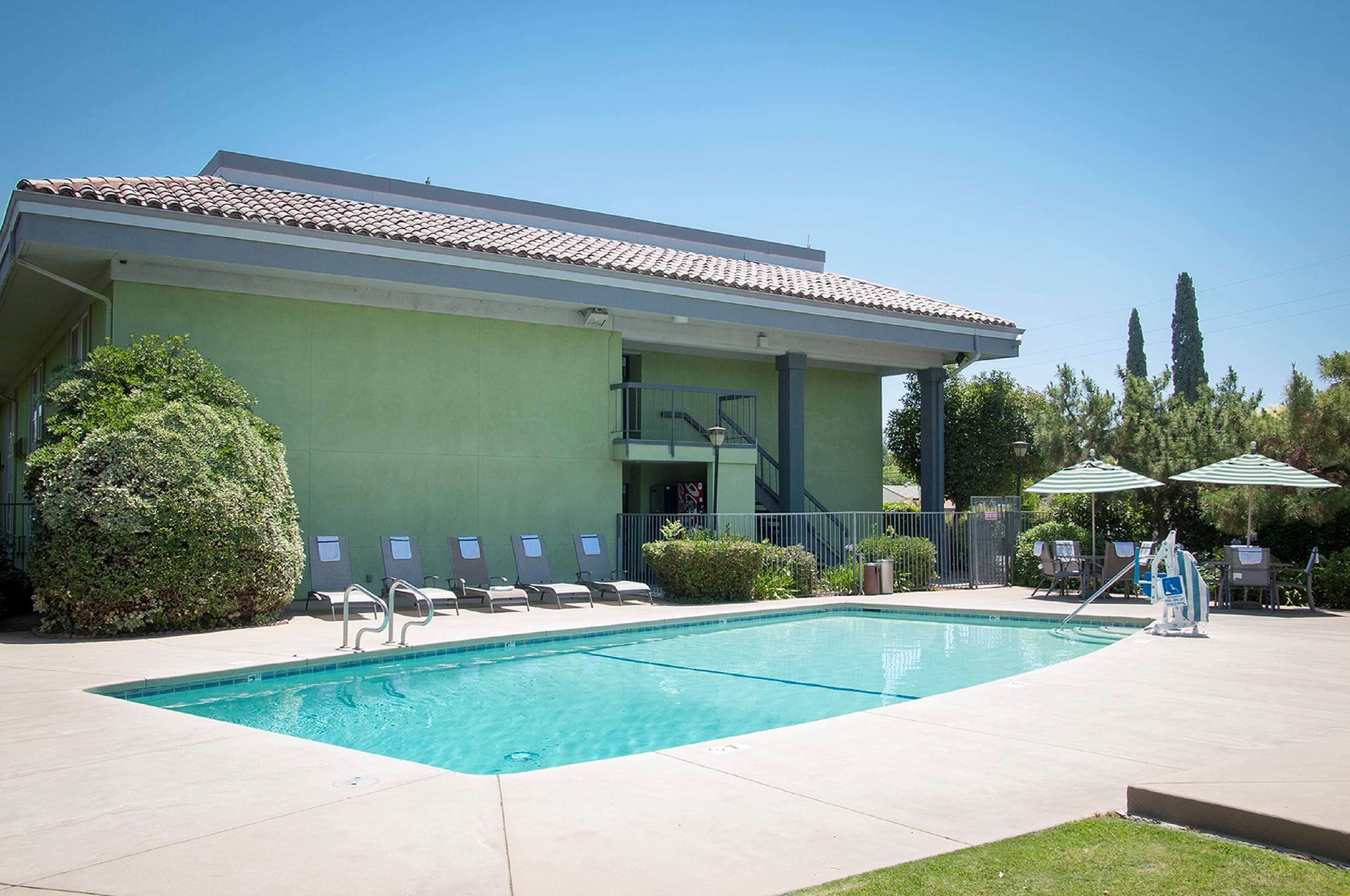 outdoor pool, pool umbrellas, pool loungers