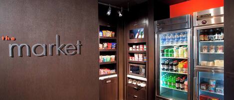 A refrigerated display case with various beverages and snacks.