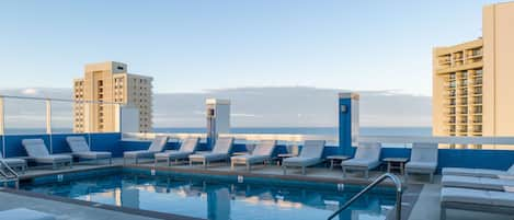 Outdoor pool, open 6:00 AM to 10:00 PM, pool loungers