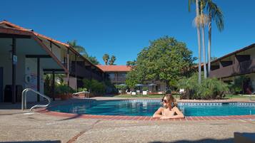 2 outdoor pools, open 9:00 AM to 10:00 PM, pool loungers