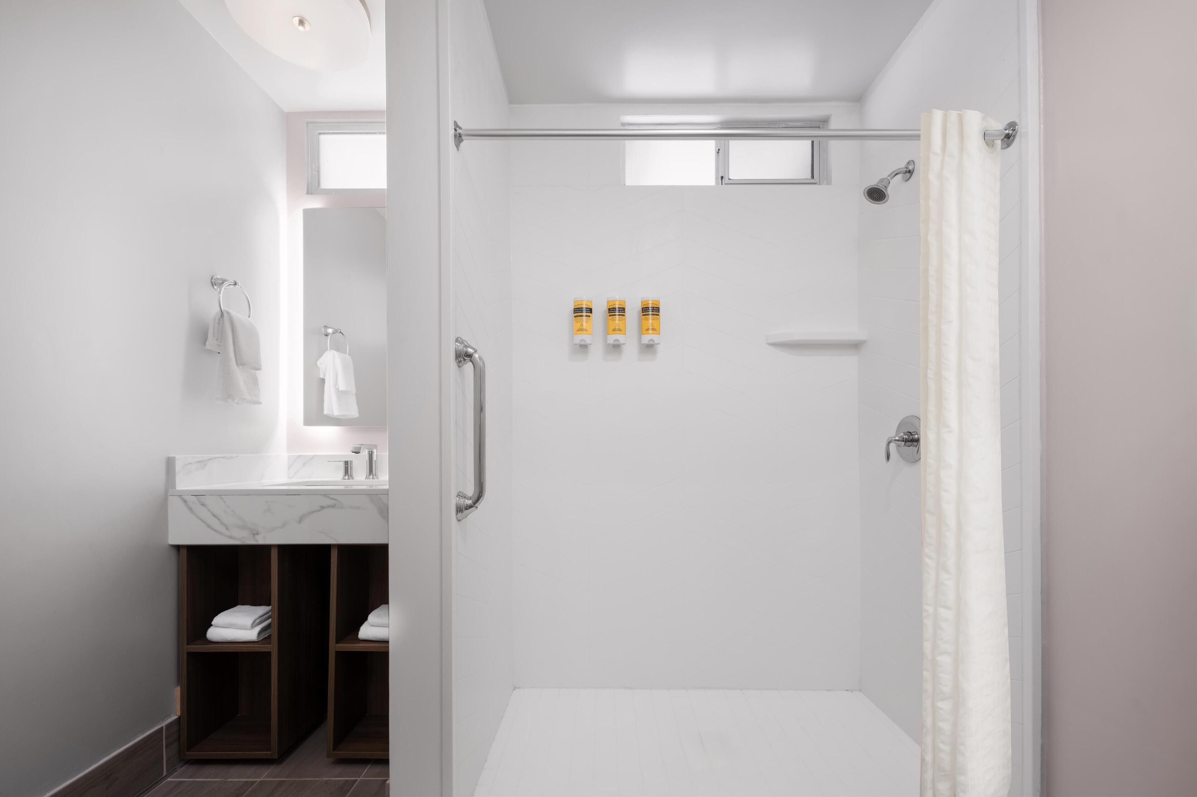 standard room, 1 queen bed, accessible, refrigerator | bathroom | combined shower/bathtub, free toiletries, hair dryer, towels